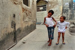 tanzania-zanzibar-stone-town-two-dark-skinned-girls-playing-i-february-island-narrow-street-small-girl-years-old-outdoors-36422943