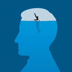 A man floating with a life belt waves for help