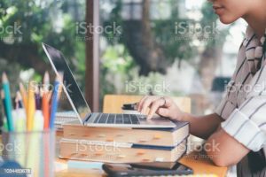 University students using laptop meeting for research homework in college