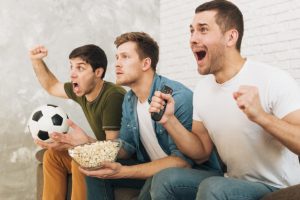 close-up-friends-watching-football-game-screaming-shouting_23-2148160148