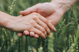 man-and-woman-holding-hands-nataliia-kika