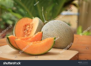 stock-photo-whole-and-sliced-of-japanese-melons-honey-melon-or-cantaloupe-cucumis-melo-on-wooden-table-1376235665-1